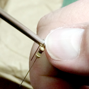 Making smooth bends for the axial leads. Its a personal preference.